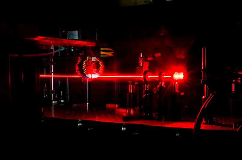 A beam of femtosecond laser pulses excites ultafast  processes in a magnetic material.